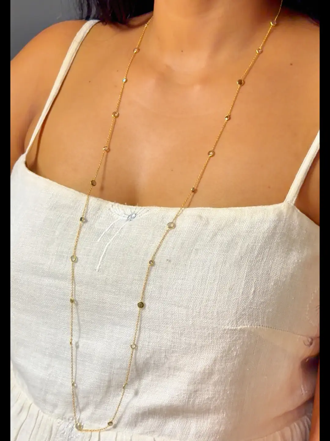 Antara worn at full 36-inch length, falling below the chest