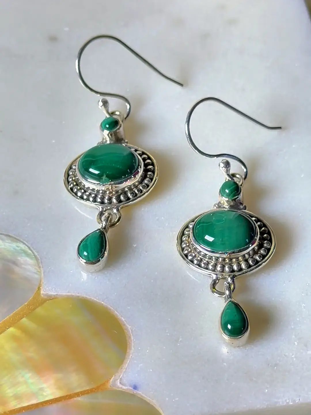Aranya malachite drop earrings, showing the beaded silver frame