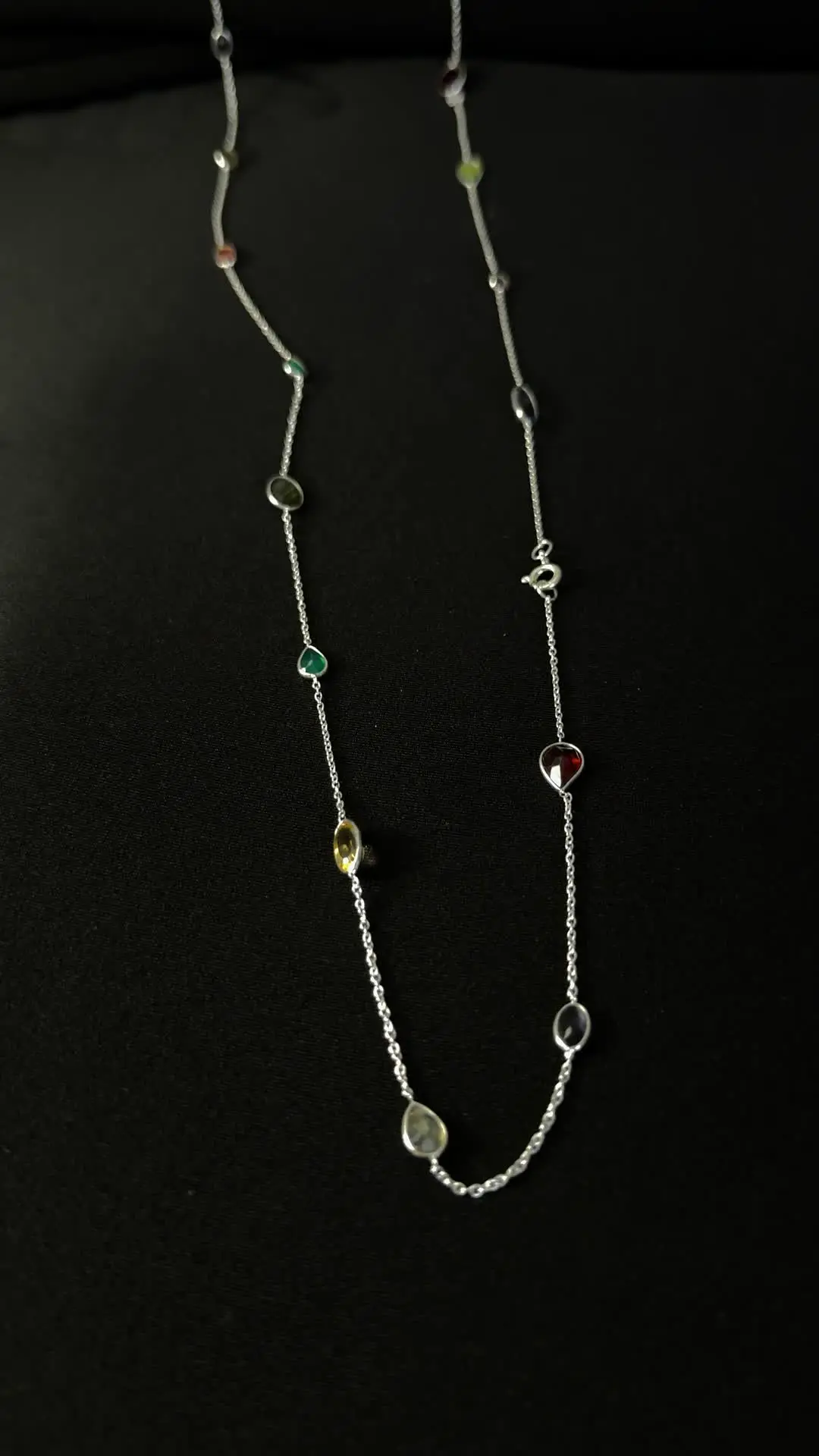 Buntee necklace — a long silver chain scattered with gemstones in every colour
