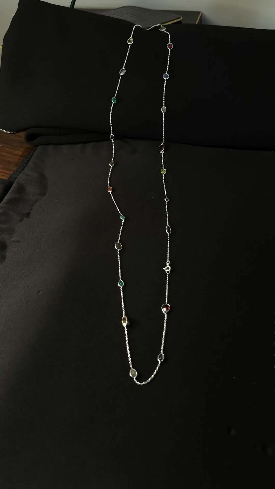 Close view of the Buntee bezel-set gemstones on silver