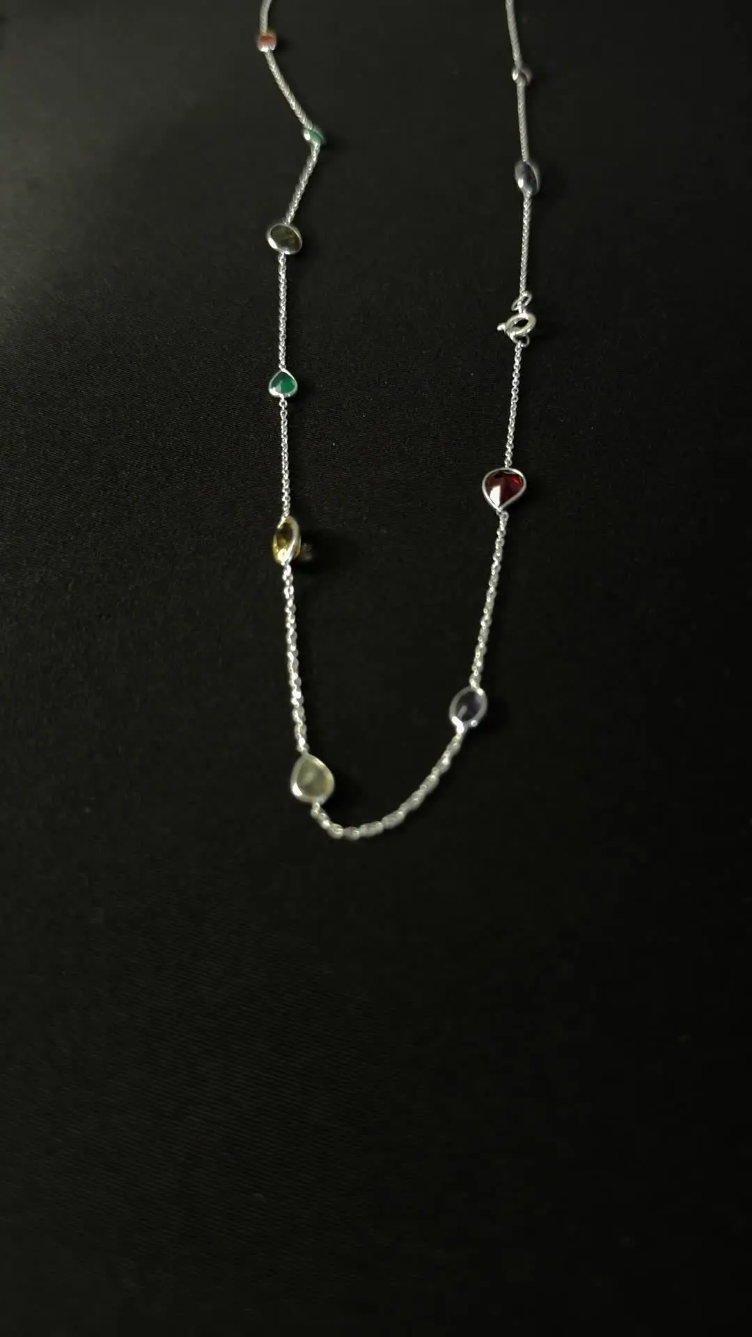 The long Buntee silver chain laid out