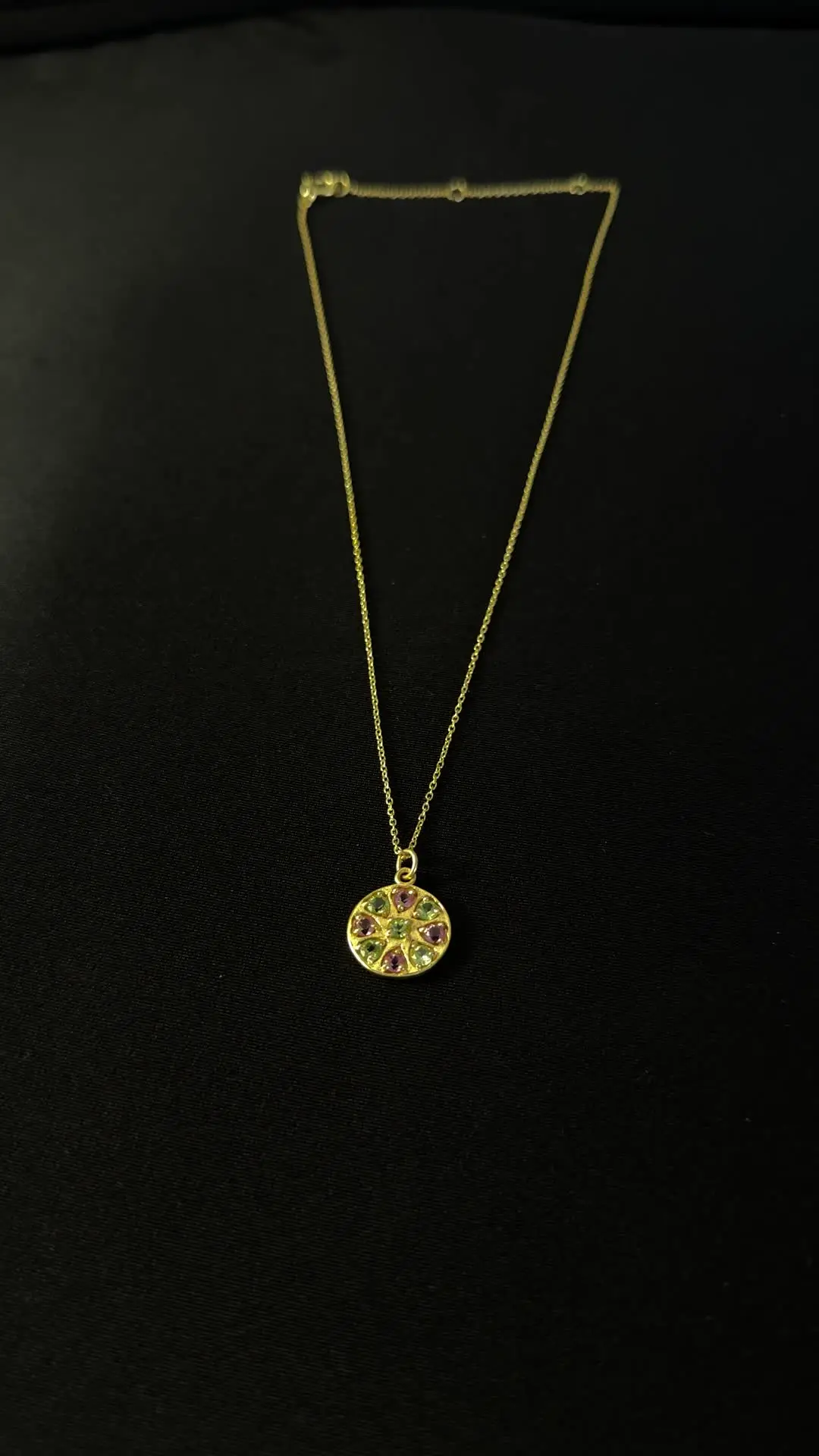 Close view of the Chakra rosette of peridot and tourmaline
