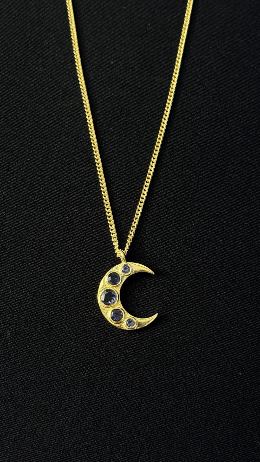 The Chandra crescent on its fine gold chain