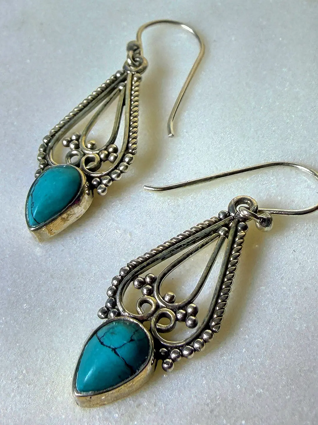 Close view of the Firoza granulation, rope borders and turquoise bezel