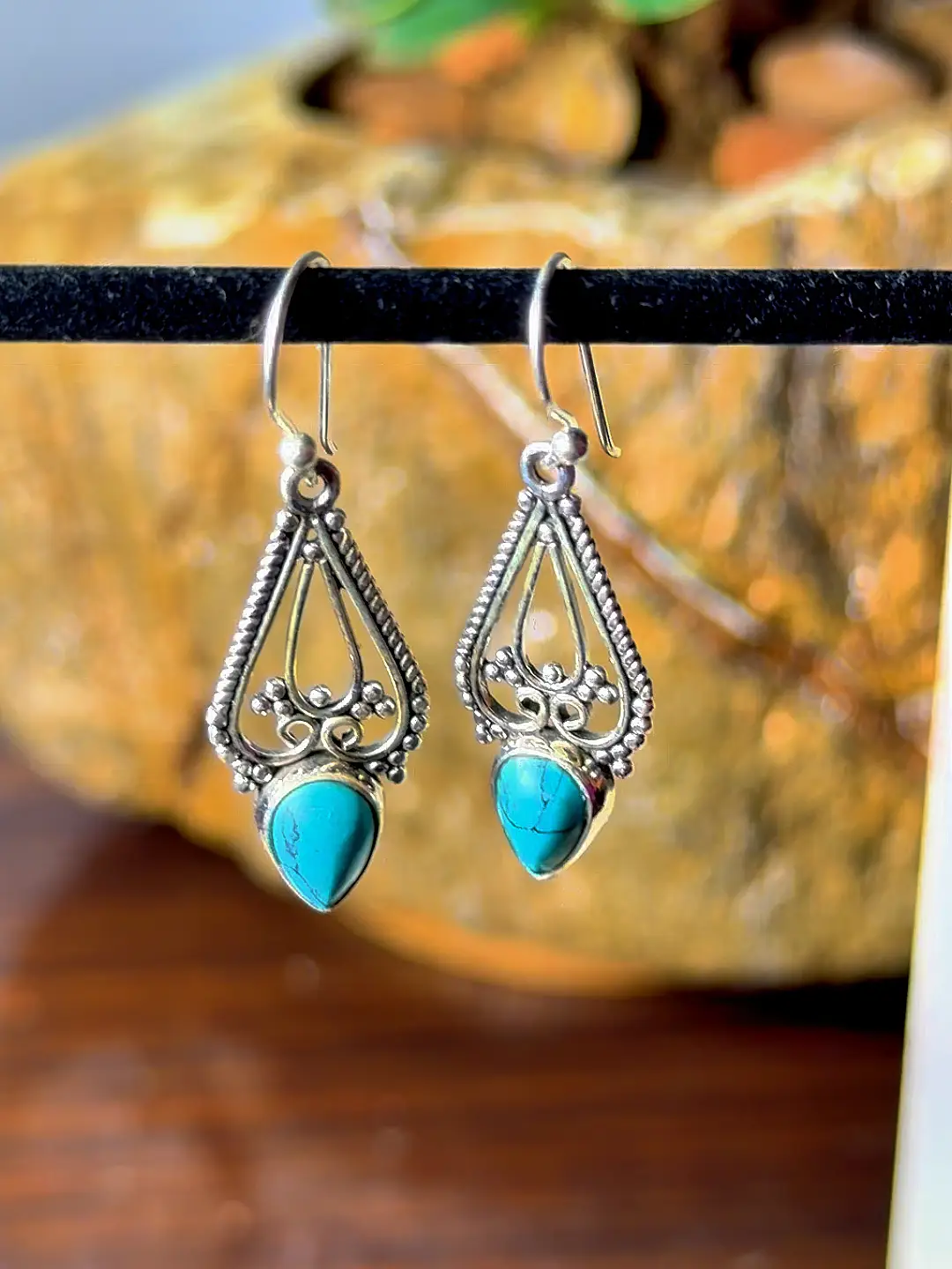 Firoza turquoise drop earrings hanging, showing their drop and French hook wires