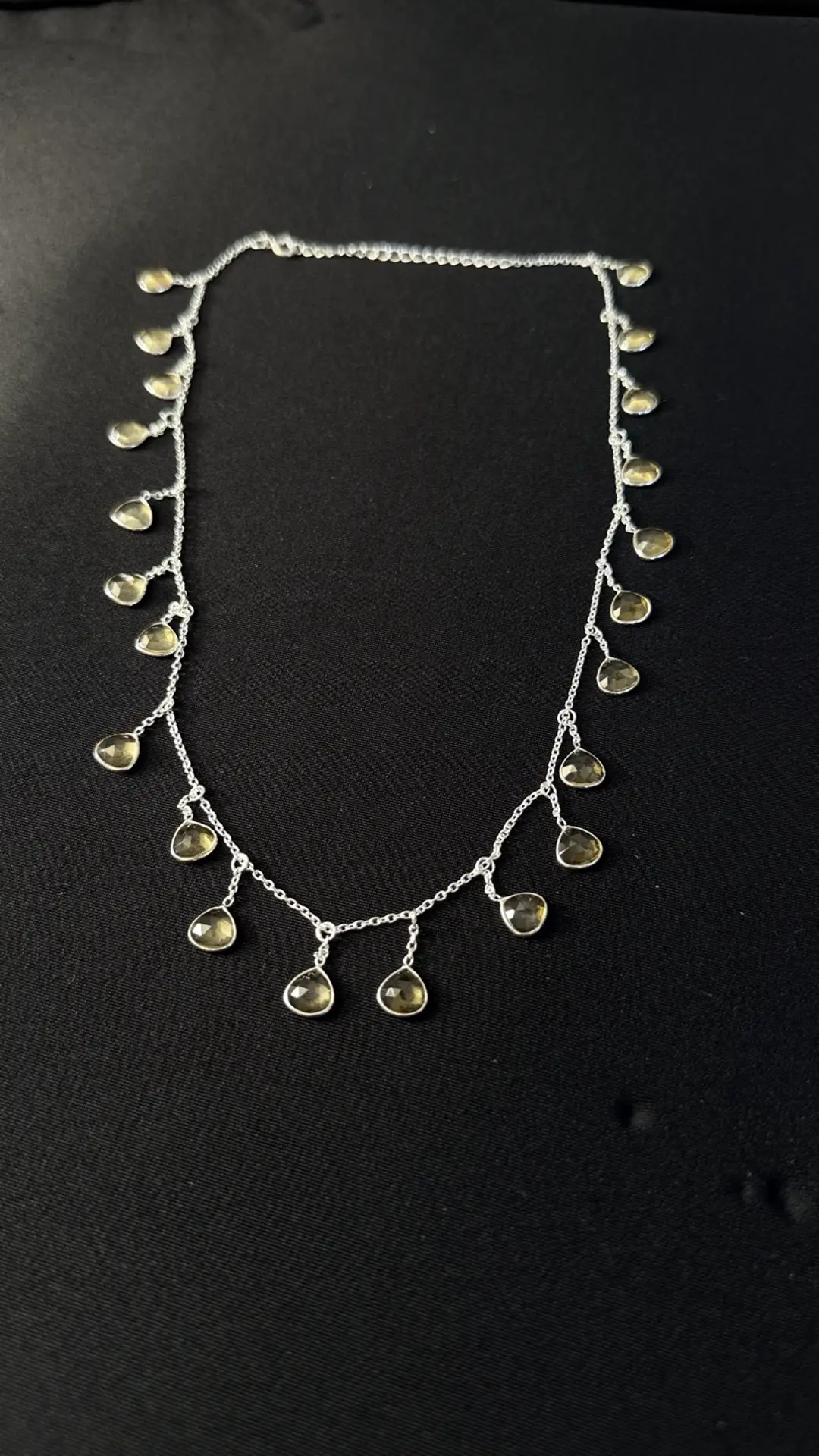 Close view of the Jhalar citrine drops on silver