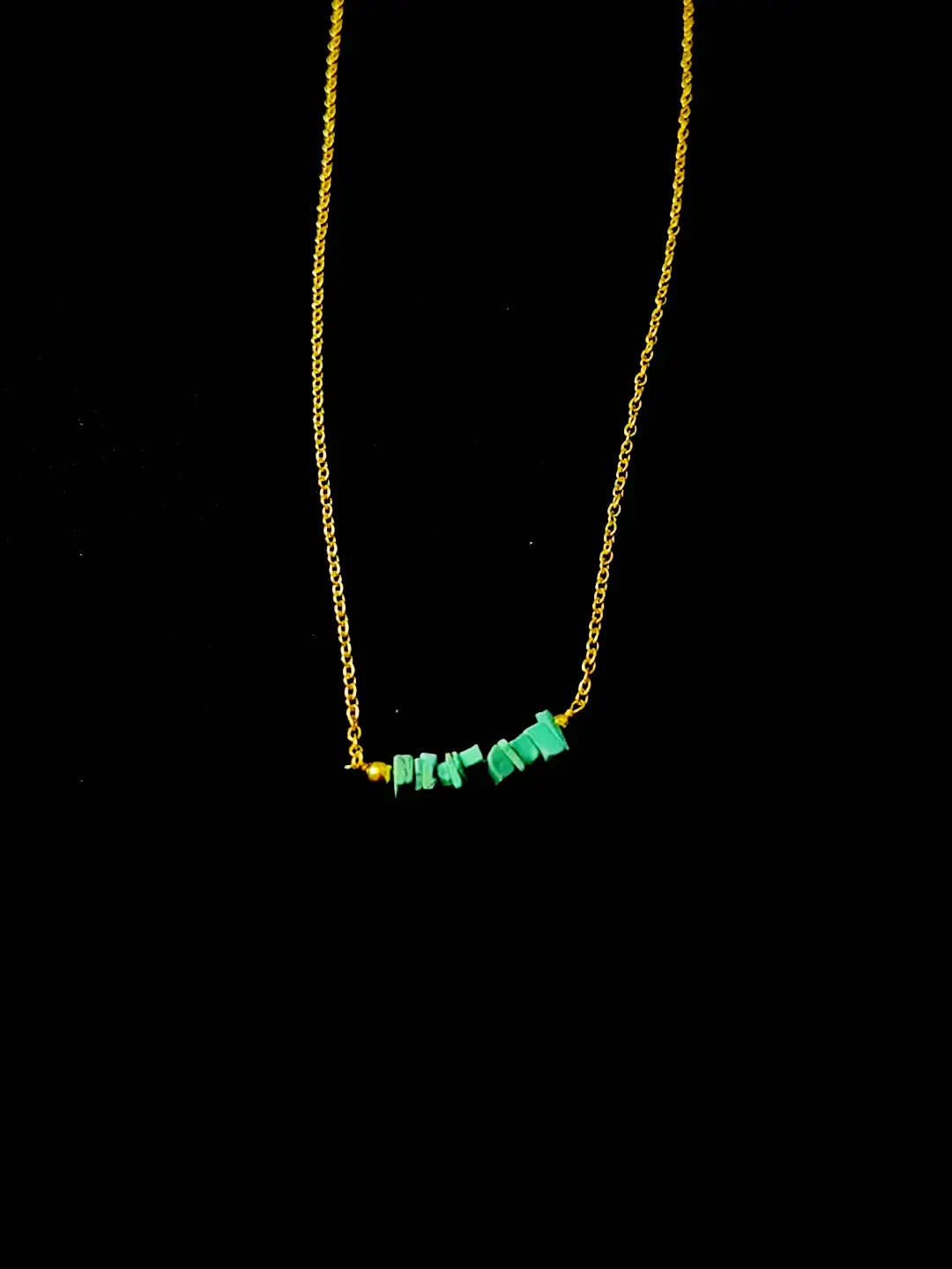 The Kinara turquoise chip bar on its whisper-fine gold chain