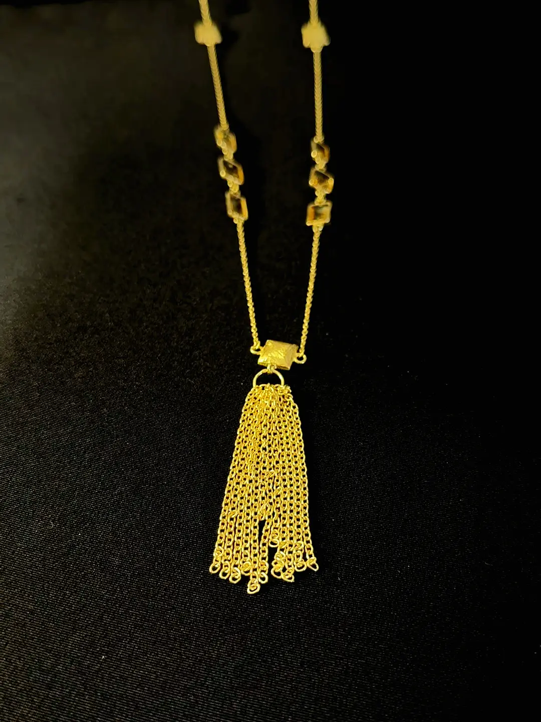 The Kiran chain tassel below its brushed square bead