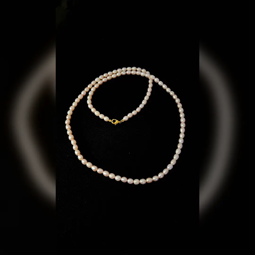 Moti freshwater pearl mala — a long blush-toned pearl strand with a gold-plated 925 silver lobster clasp