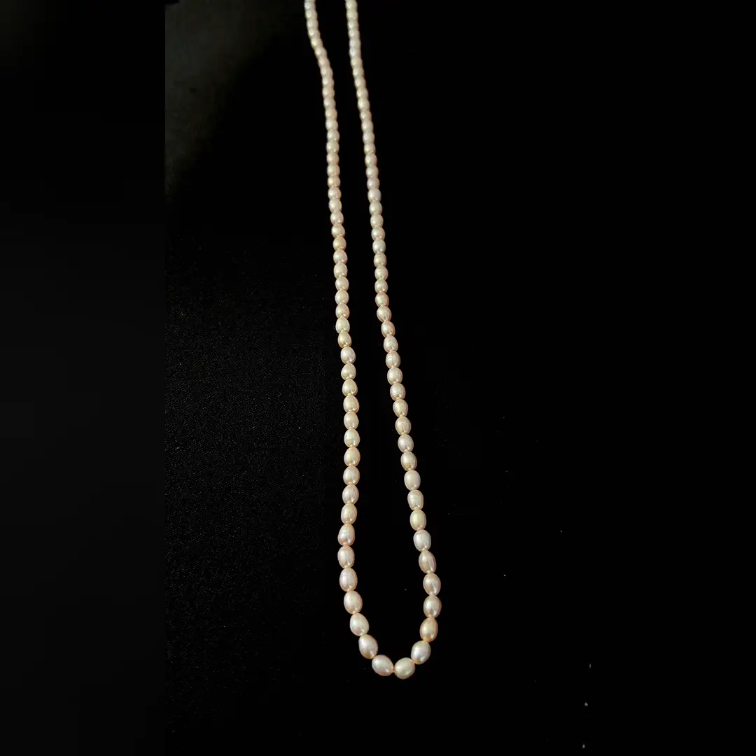 The full length of the Moti pearl mala laid out