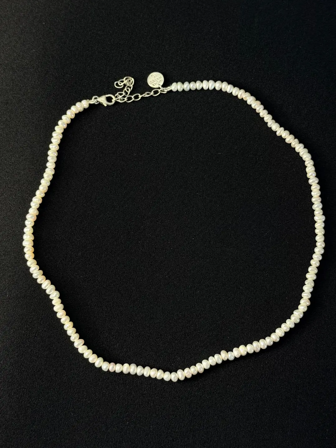 Close view of the Noor freshwater button pearls and their soft lustre