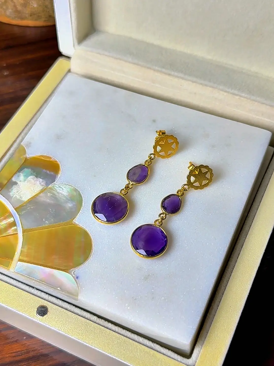 Sandhya amethyst drop earrings shown in their Silvorious box
