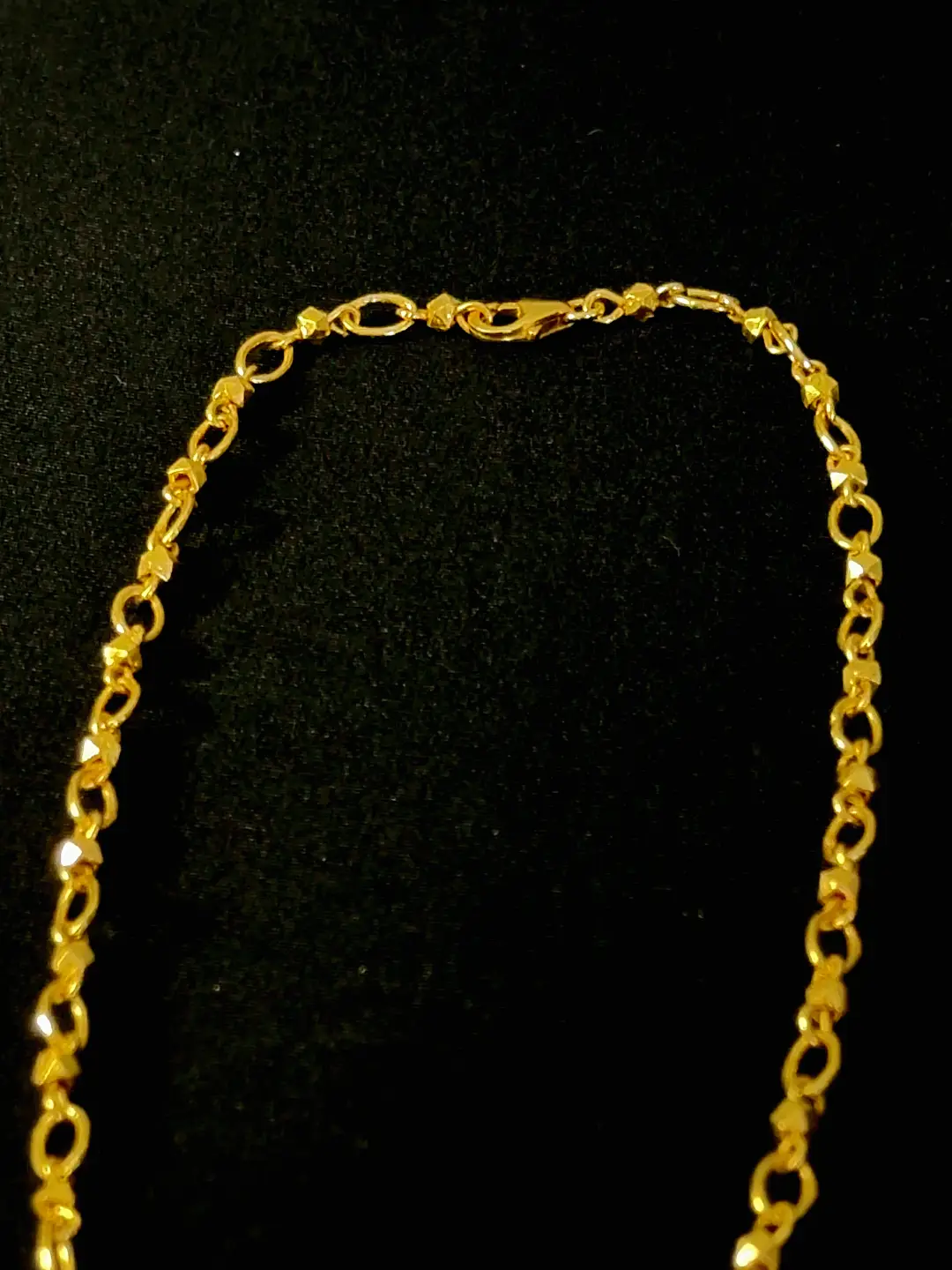 The Sutra chain clasp — lobster closure between handmade links